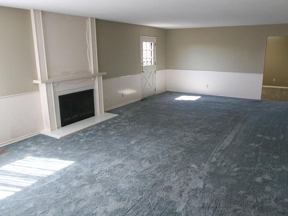 Large open living room w/ fireplace