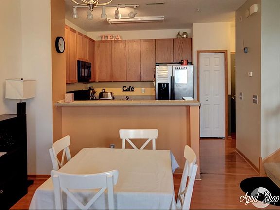 open kitchen concept with breakfast bar and informal dining area.