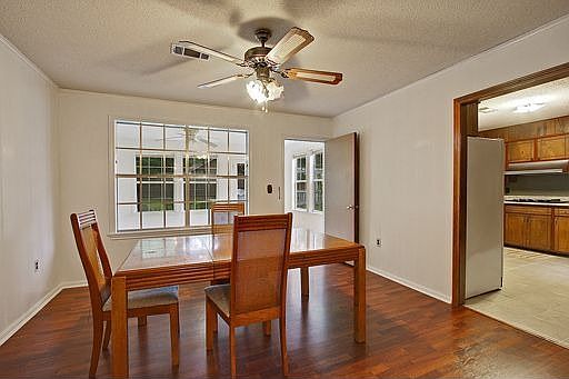 Breakfast area overlooks sunroom.