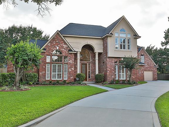 THE WINDING DRIVEWAY LEADS TO A OVERSIZED 3 CAR GARAGE WITH NEW EPOXY FLOORING - With fine attention to detail and design, this 4-bedroom home with 3 full and 1 half baths comes complete with lush landscaping, fabulous oversized backyard, swimming po