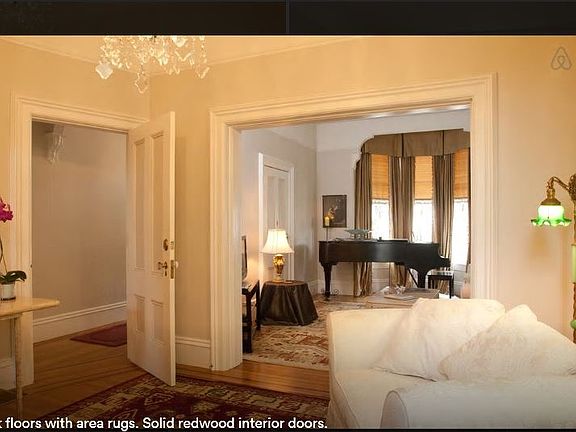 Oak floors with area rugs. Solid Redwood Interior Doors