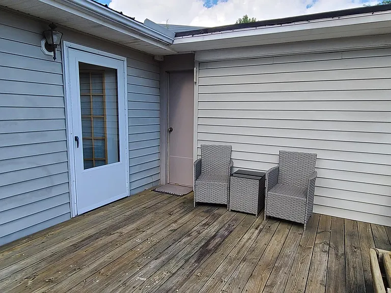 patio, showing man door to garage and door to master