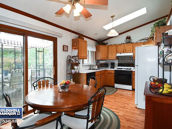 Eat in kitchen with sliding glass door to spacious deck.