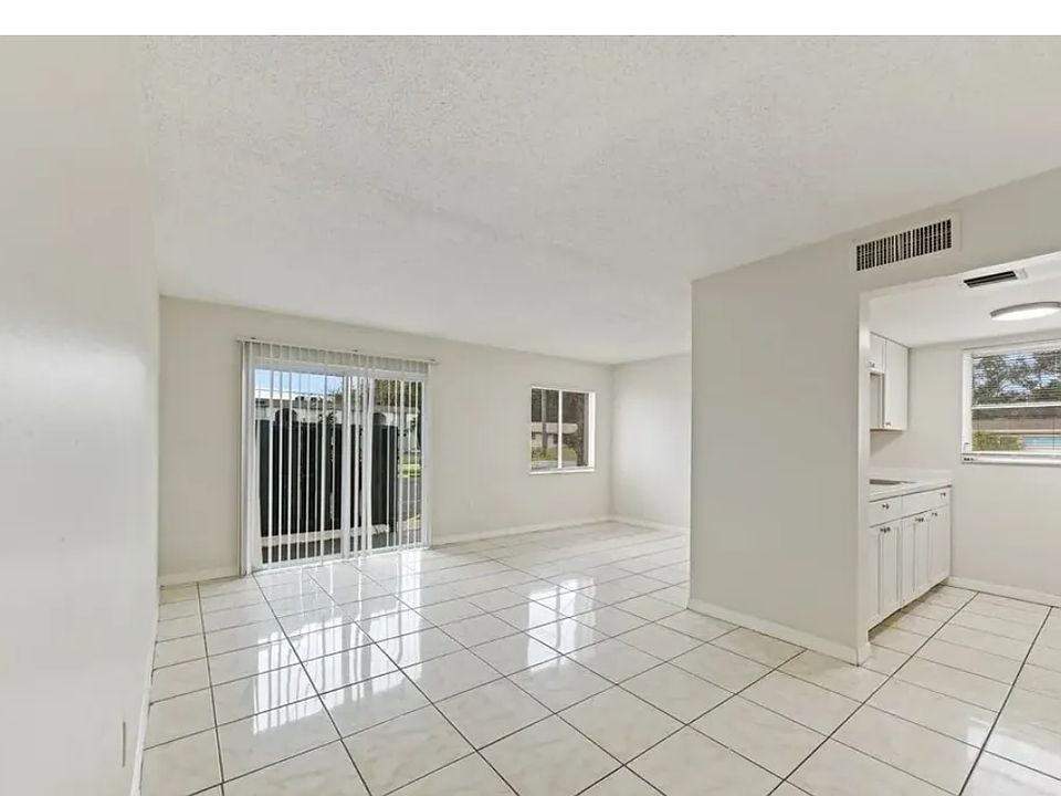 This charming 1-bedroom apartment in Pine Manor, FL, features a cozy interior with all-tile flooring throughout, offering a clean and low-maintenance living space. The living area is bright, thanks to a sliding glass door at the back. Pet deposit 100