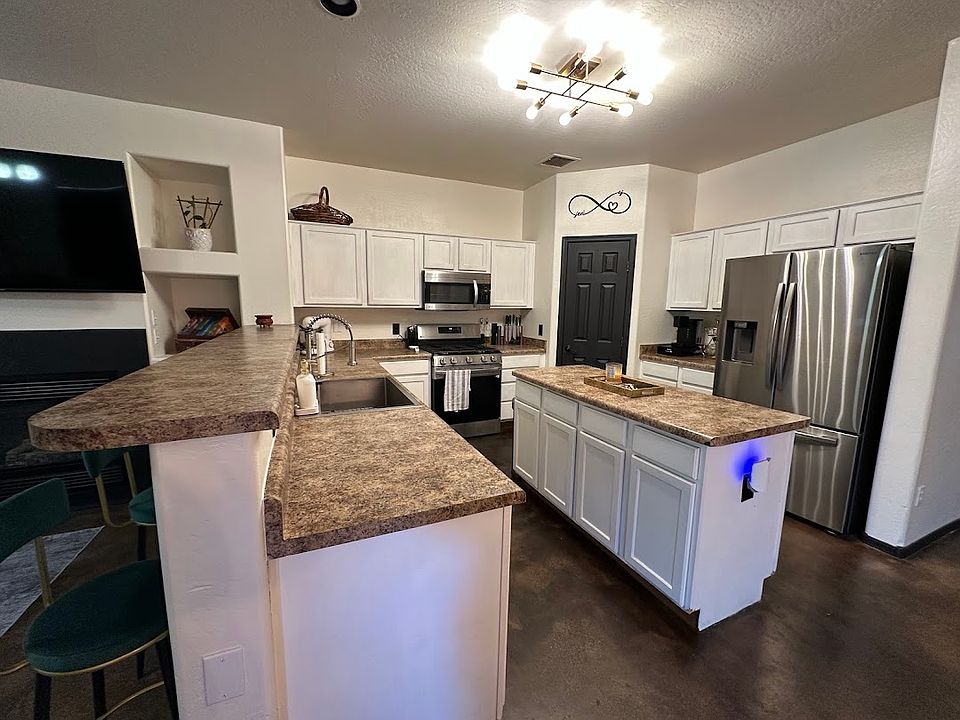 Kitchen with pantry and stainless steel appliances