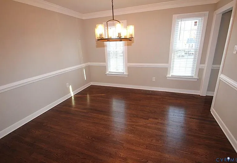Formal dining room is located to the right of front entryway.