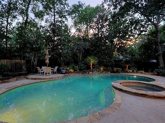 TOTALLY PRIVATE BACK YARD HAS A LARGE POOL/SPA RENOVATION SURROUNDED BY UPDATED STONE INPRINTED STAMPED CONCRETE SURROUND THAT CARRIES ON TO THE PATIO, SUN DECK AND WALK WAYS.