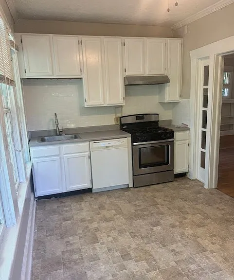 Spacious Kitchen area. New tile backsplash. Kitchen table or dining table goes here