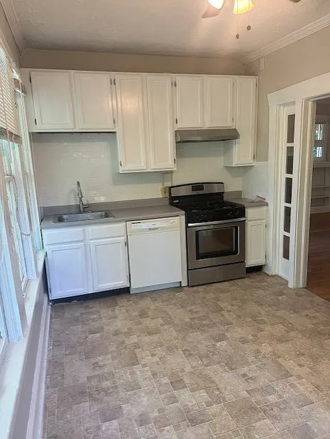 Spacious Kitchen area. New tile backsplash. Kitchen table or dining table goes here