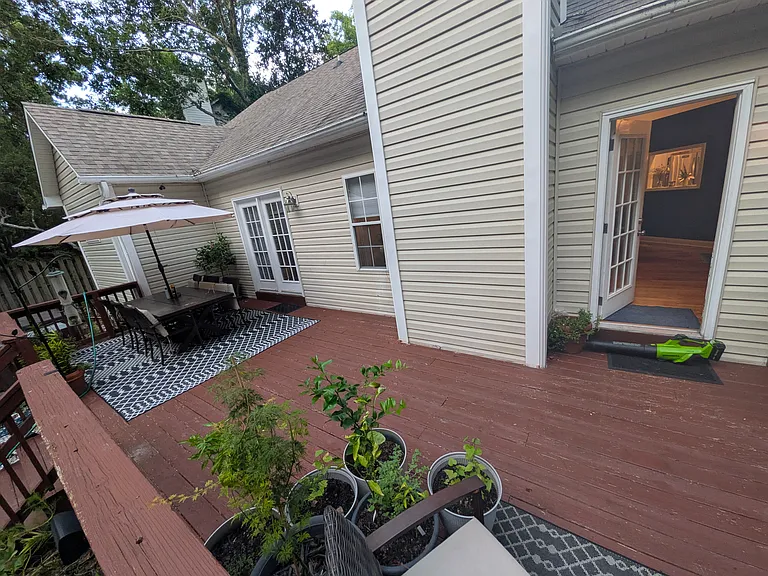 Spacious Back Porch
A large back porch that extends the home's living space outdoors. There's plenty of room for comfortable patio seating, plants, and entertaining friends and family while overlooking the private backyard.