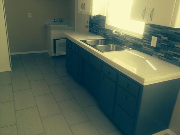 New quartz countertop and tiled floor