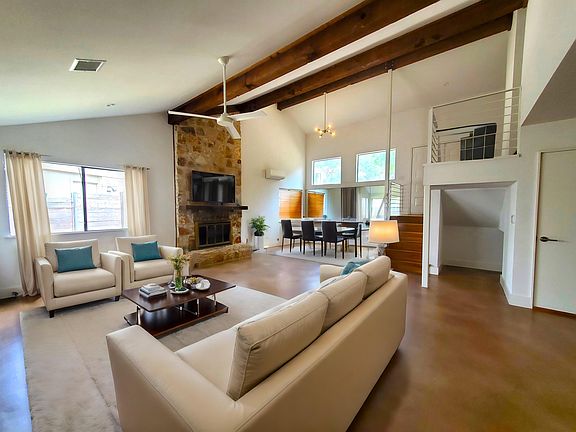 Living Room with View of Stairs to 2nd Floor - Virtually Staged