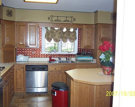 Kitchen - Newly Installed Porcelain Tile Floor and Copper Backsplash!