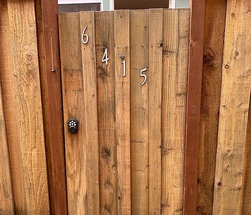 locked gate with code to private patio/yard
