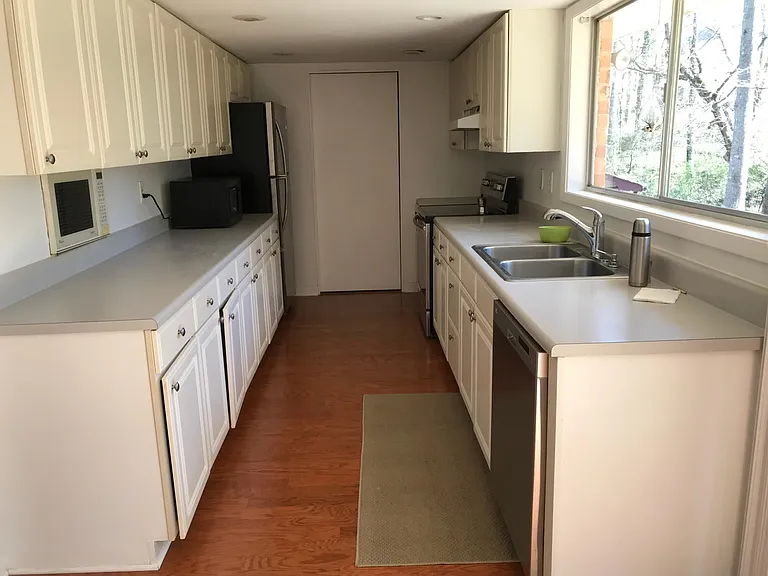 Kitchen, new fridge, new range, new dish washer; with astonishing view to the backyard