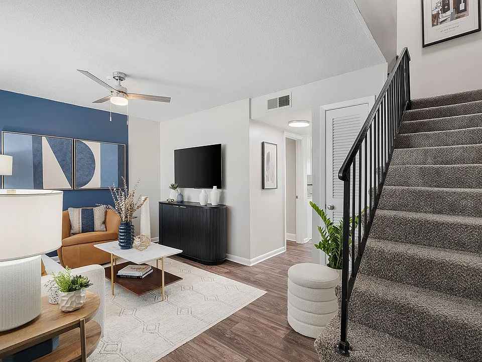 Living room with hardwood-style flooring & ceiling fan