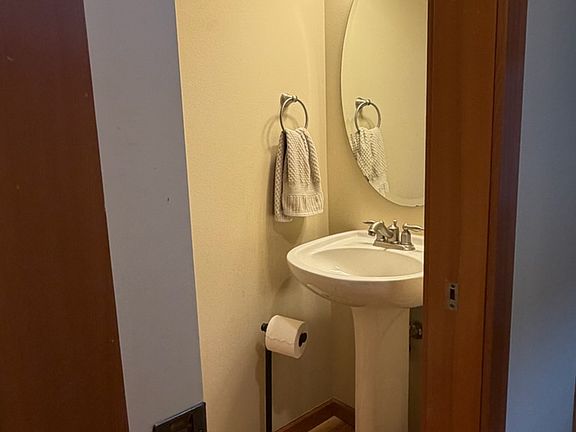 Powder room in the hallway towards the kitchen