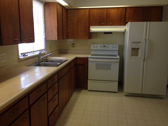 Stove and side by side refrigerator provided