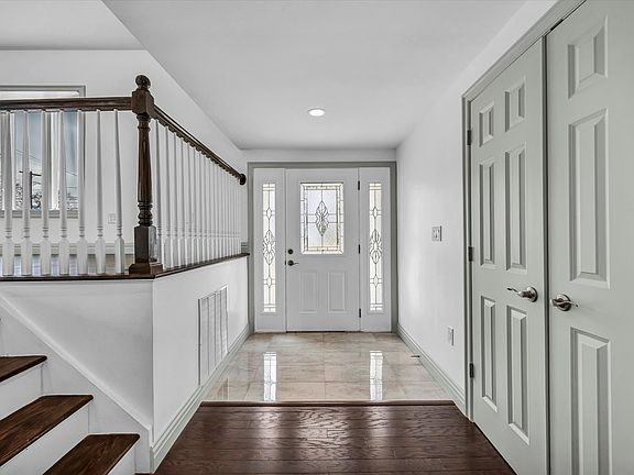 Grand entrance foyer with large coat closet