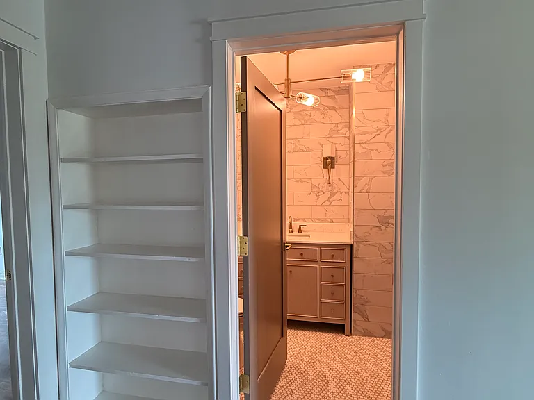 Built in Bookshelf and Guest Bathroom Entry