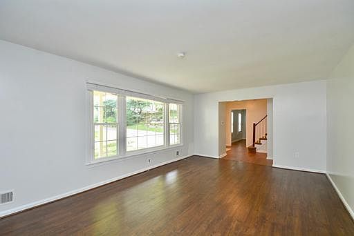 Large living room with picture window.