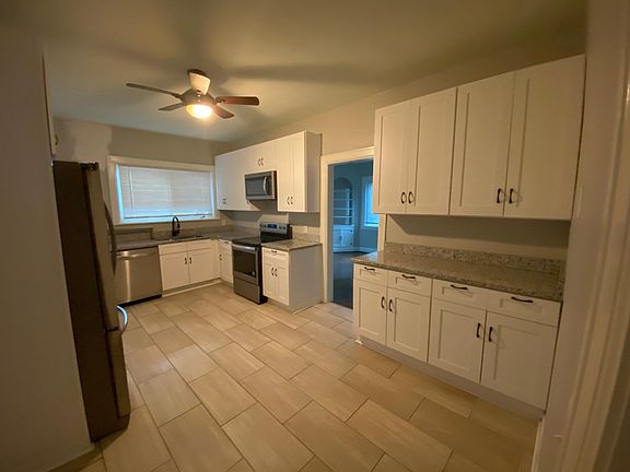 New kitchen with granite countertops, white shaker cabinets, nice appliances, tons of storage & walk-in pantry. Dishwasher, microwave, new french door refrigerator, smooth cooktop electric oven