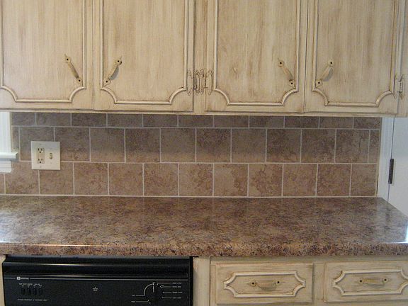 This is the view of the cabinet and tile work in the kitchen