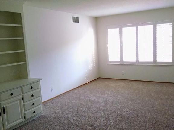Living room w/built in cabinetry.