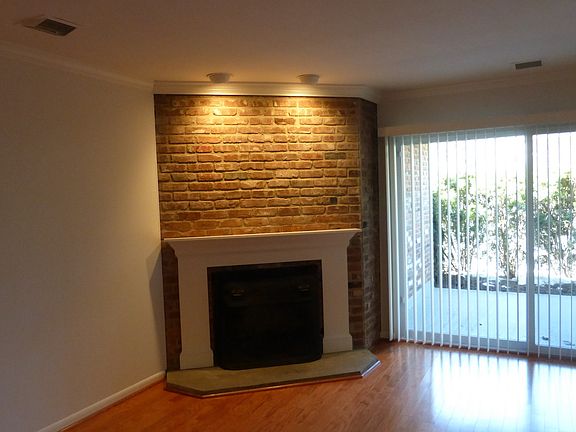 Living Room with Fireplace and Sliders to the Patio