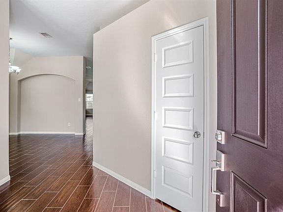 Gleaming wood like tile floors greet you as you enter the home.