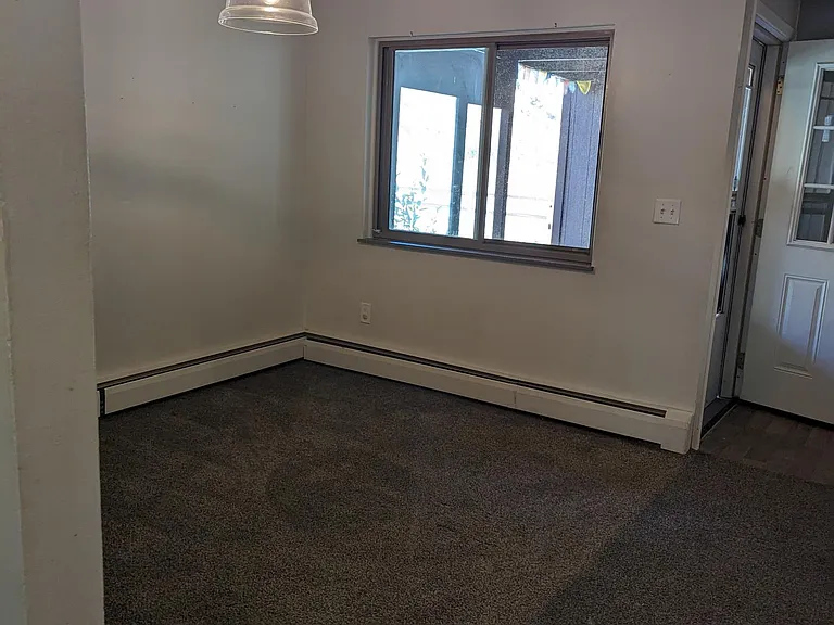 Dining room is adjacent to kitchen and front door and is large enough for a table for 6!