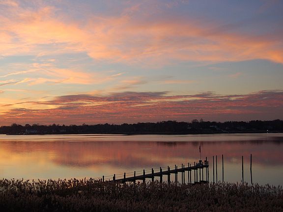 View of the sunset from the rear yard.
