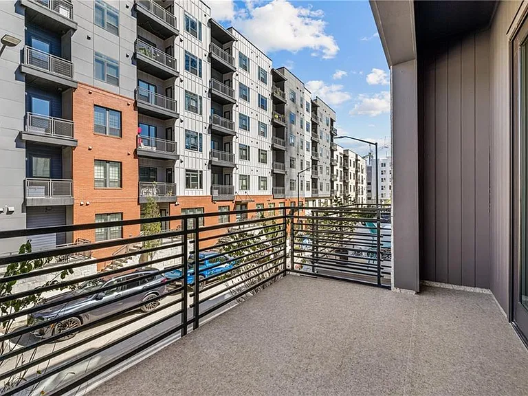 Front Patio (Note: Actual unit has light wooden floors and upgraded fixtures / appliances)