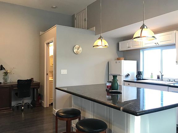 Bathroom (back corner) + Additional Storage Space (above bath)