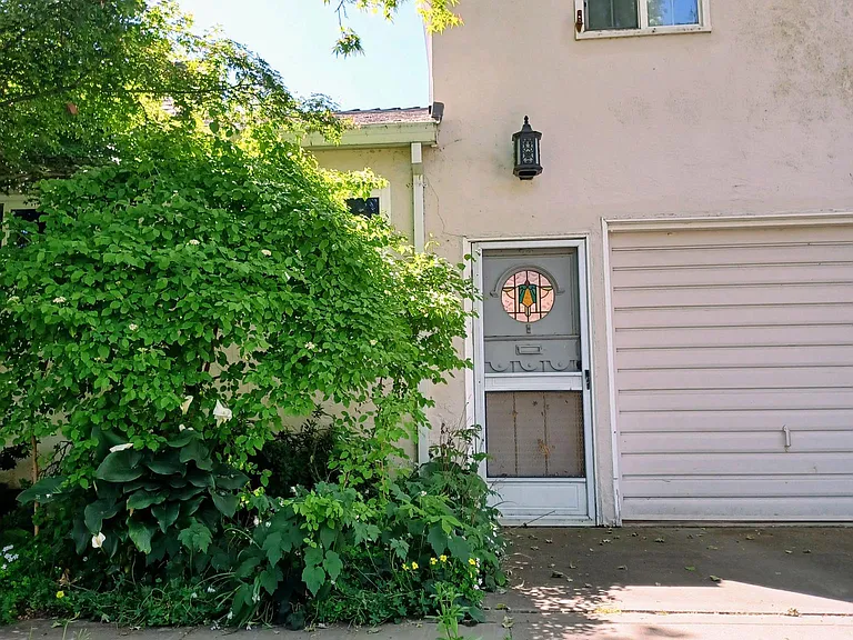 First entryway off West Curtis Drive