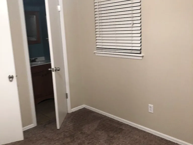 Master bedroom looking into half bath