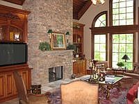 Vaulted family room with stacked stone fireplace 