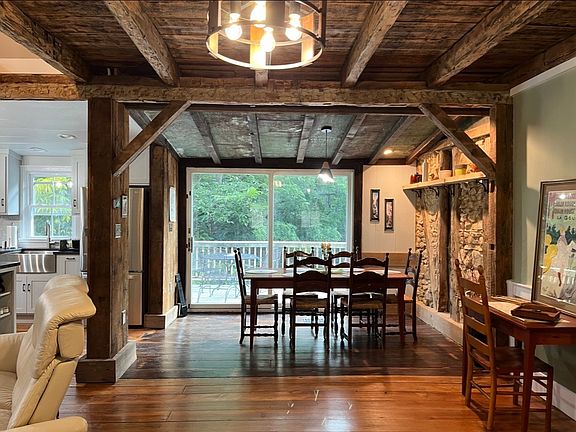 Dining Area with large sliding glass door to deck. American Chestnut floor