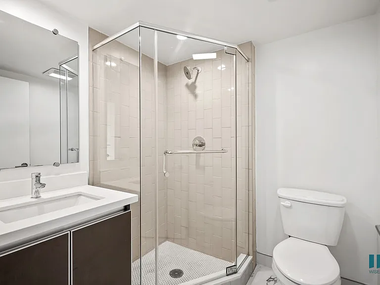 Bathroom with Walk-In Shower and Vanity Cabinet Storage