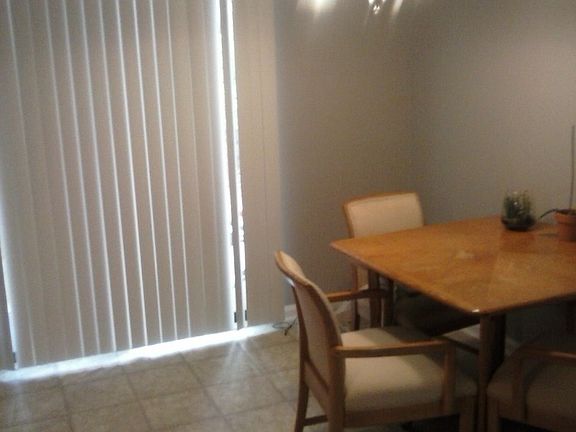Angle of kitchen, sliding glass door to porch #1