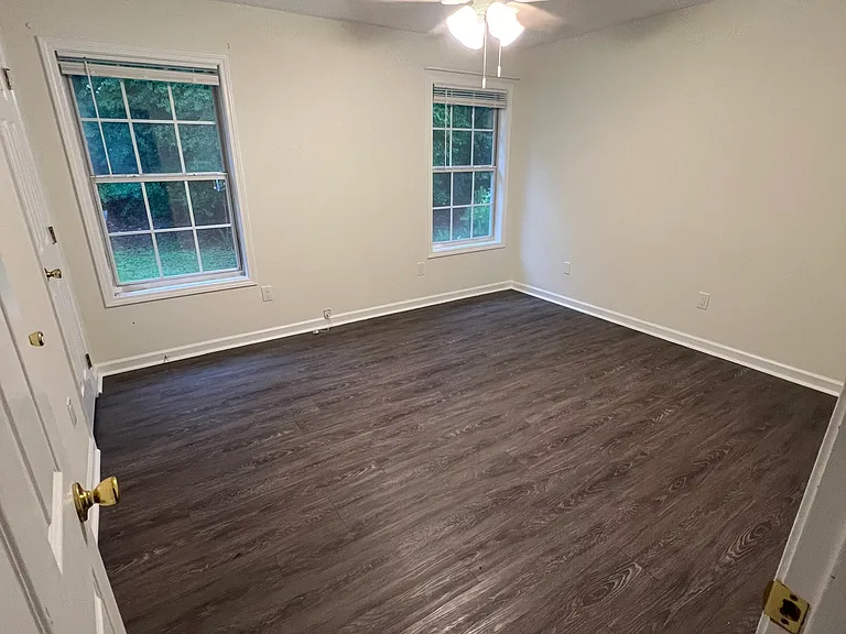 One of three bedrooms. These two bedrooms are on separate wing from the master, separated by the living room, with their own bathroom to share.