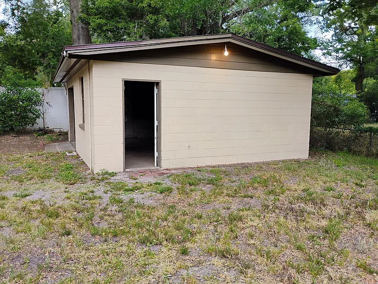 Side view of Detached Block Garage, 480 square feet with new roll up door.