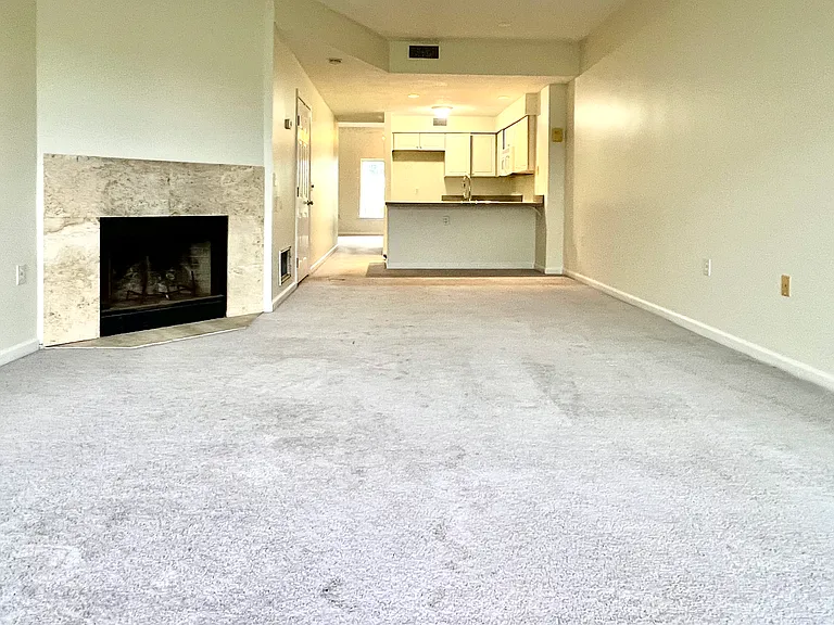 view of empty living room with fire place