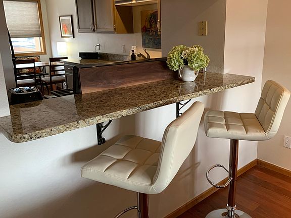 View from Living room through counter top into kitchen