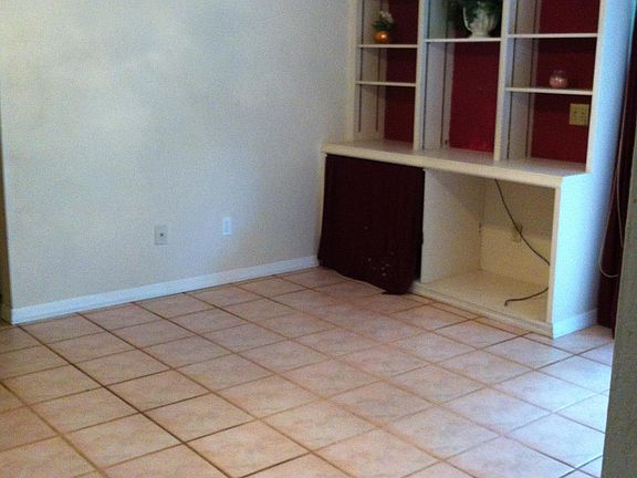 Family room. Shelves are all white.