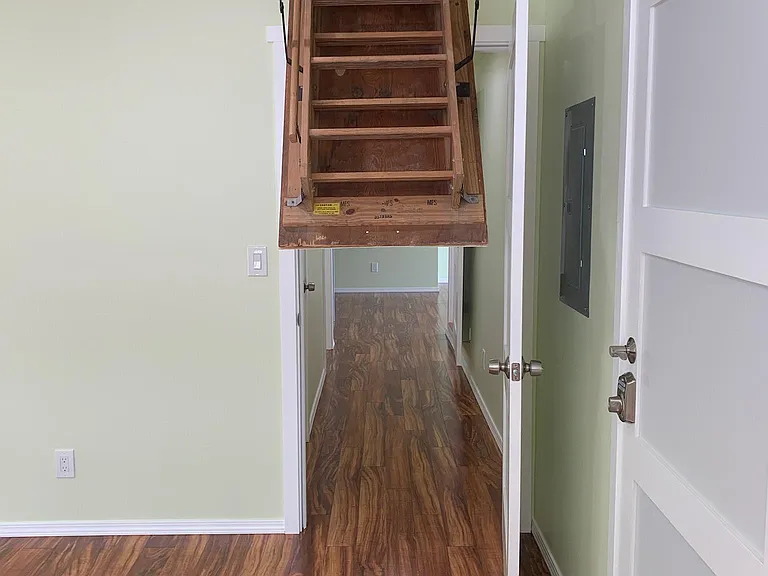 Attic Staircase with Significant Storage (access in master bedroom)