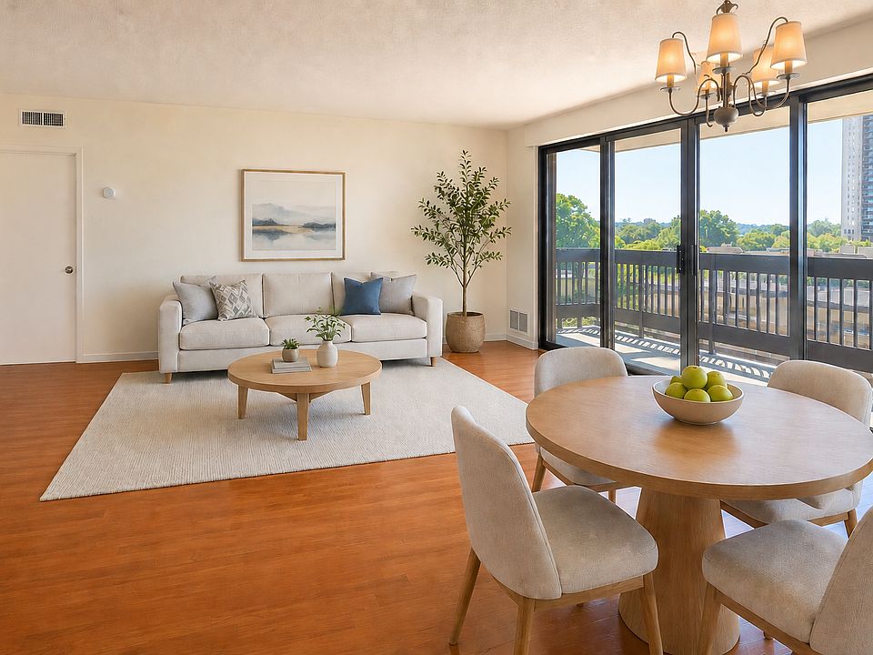 Living/dining area virtually staged to show layout options. Unit is leased unfurnished.