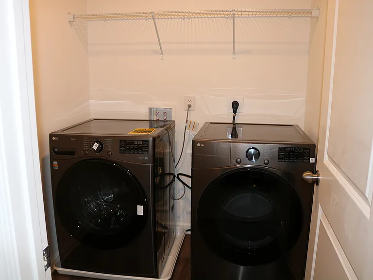 Laundry room with brand new LG washer and dryer