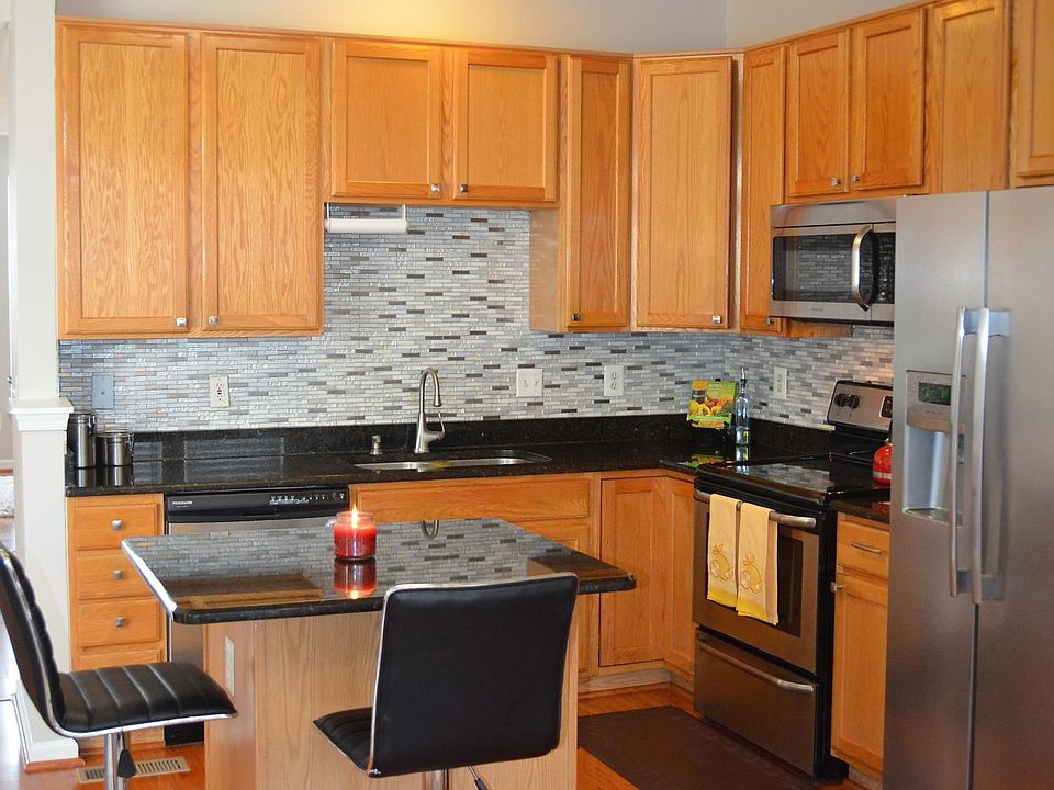 Updated Kitchen with custom backsplash and granite counterto