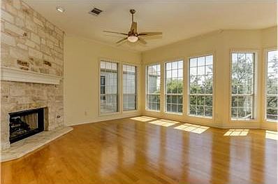 Family room with stunning views and stone fireplace